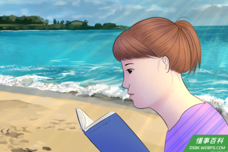 Girl with Down Syndrome Reads At Beach.png